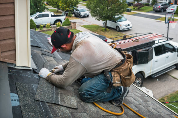 Professional Roof Replacement technician working in Oakes, ND